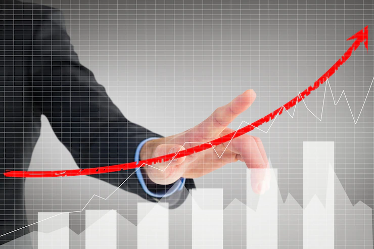 Businessman-showing-business-evolution-with-graphic_1134-294